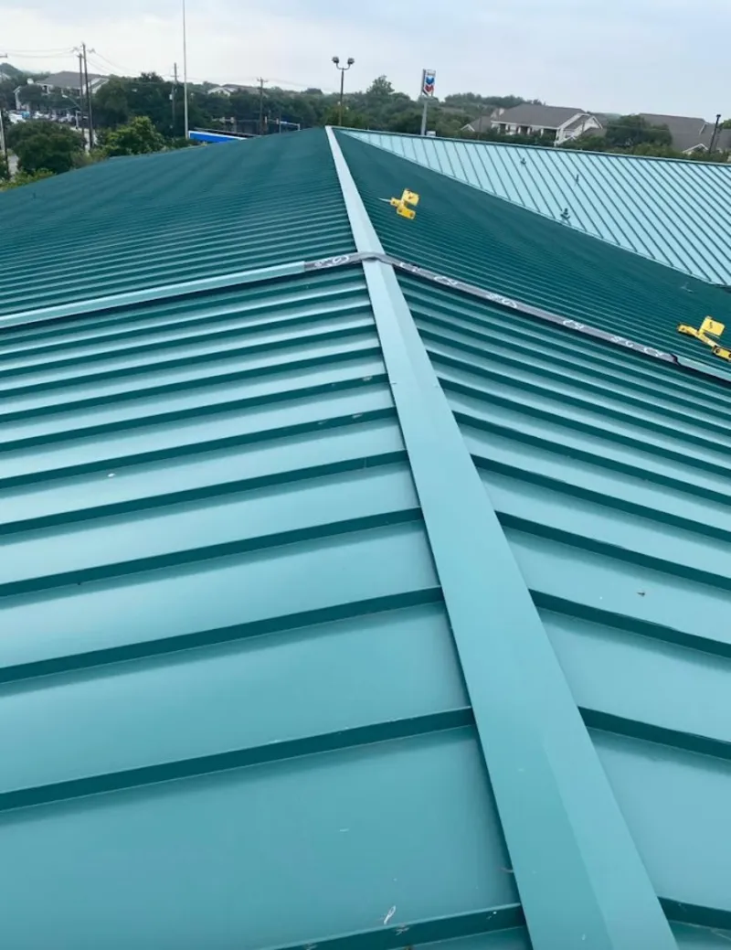 Green commercial metal roof ridge and valley for Metal Roof Repair in Harborcreek